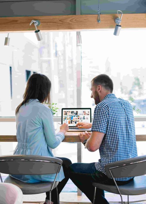 back-view-colleagues-working-laptop (1) (1)